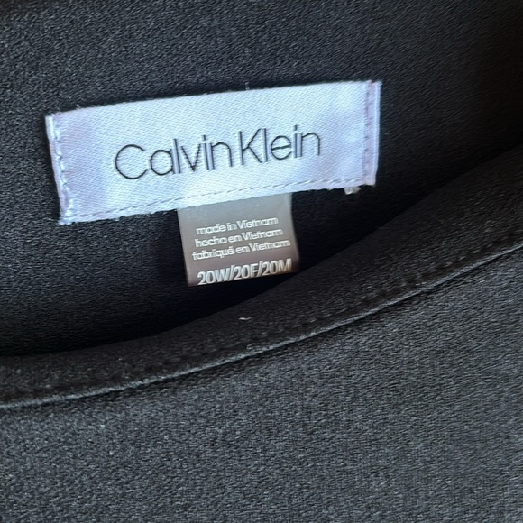 Calvin Klein's dress skims stretch, with button-accent bell sleeves for flair. - Picture 6 of 12